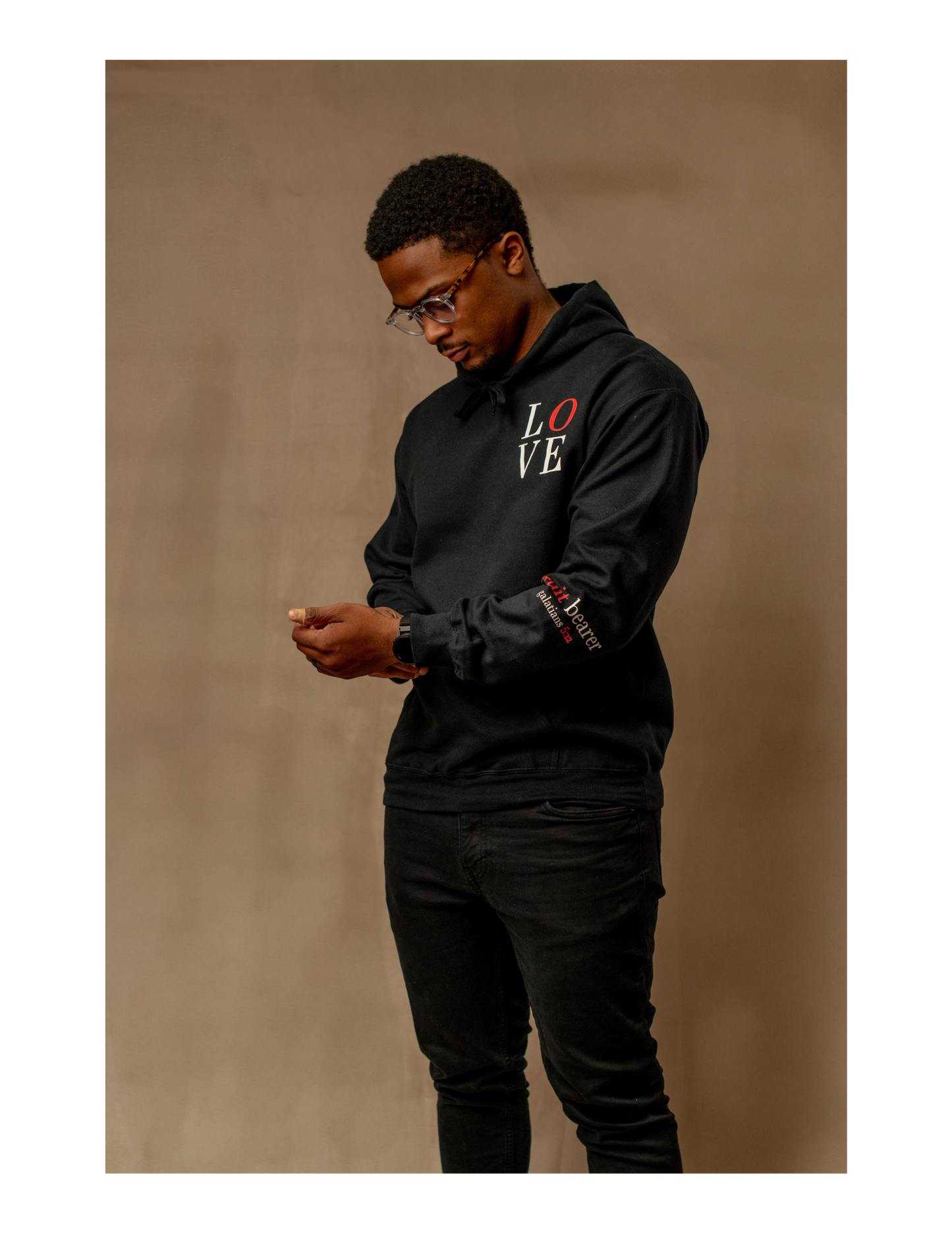Guy wearing Black LOVE Hoodie-Side view